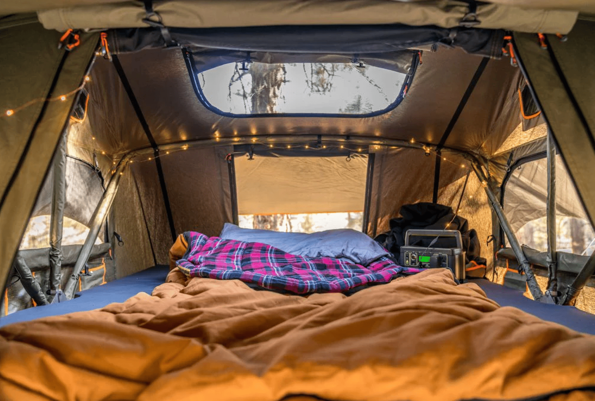 roam-vagabond-roof-top-tent-inside-view-with-bedding